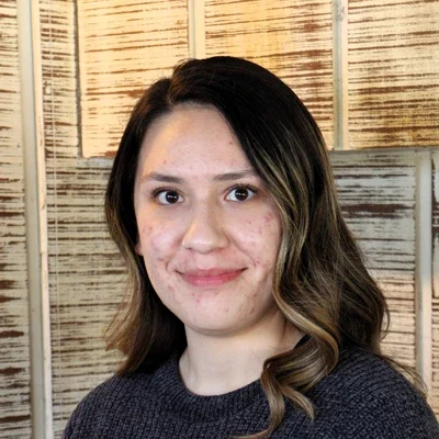 A headshot photo of Andrea