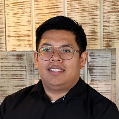 A headshot photo of Santos